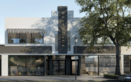 A modern two-story commercial property labeled “WHITWORTH” features ground-floor businesses “MED SPA” and “GREEN ACRE,” large windows, a striped awning, and a tree in front.