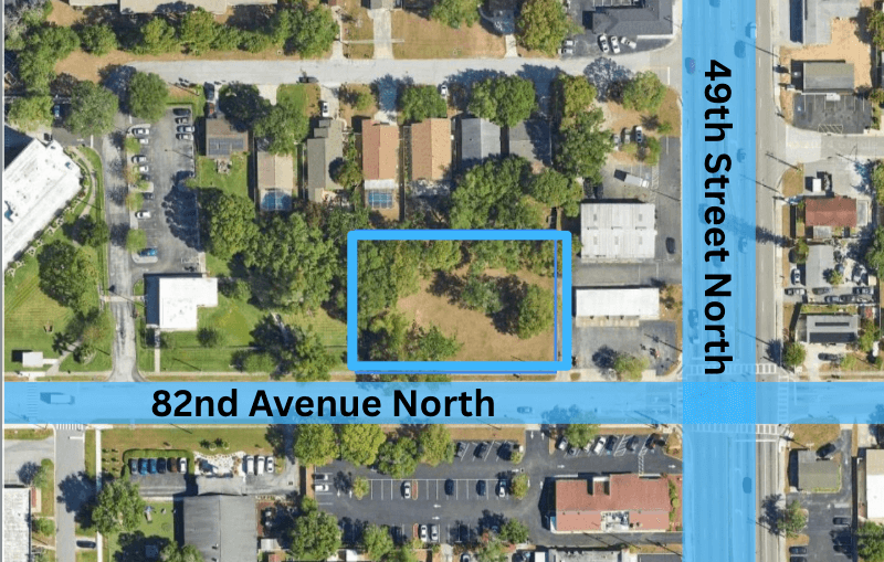 Aerial view of the intersection where 49th St. N. meets 82nd Ave N., showing a rectangular lot outlined in blue northwest of the intersection, now marked as SOLD.